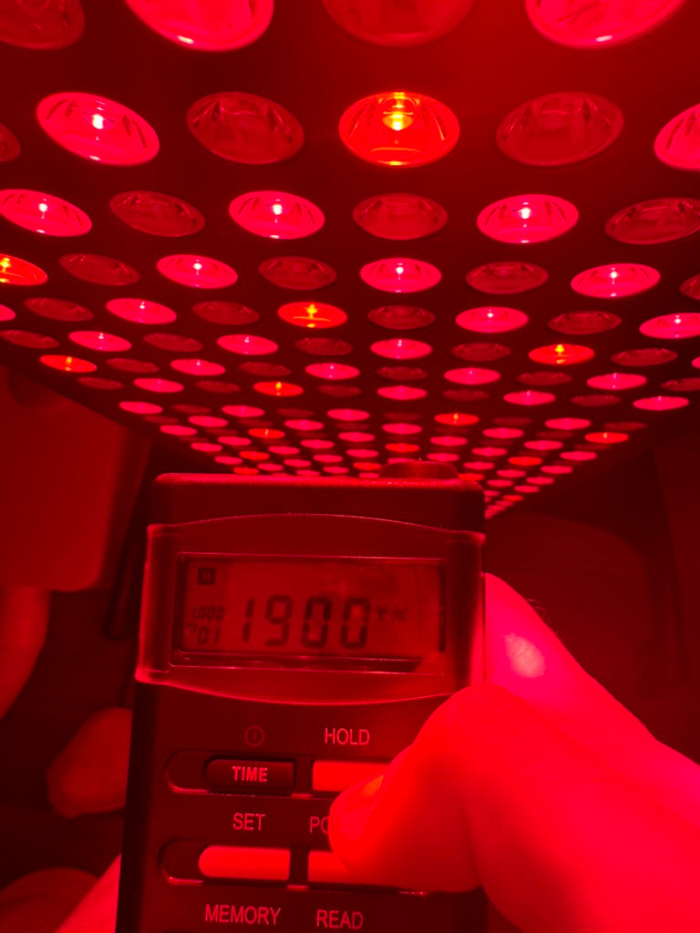 EMF reader used on red light therapy panel showing 190cm/mw2