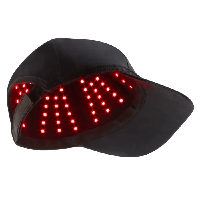 HeroHat LED red light therapy cap showing illuminated underside LEDs