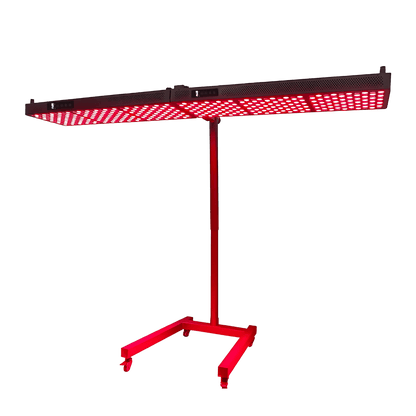 Illuminated red light therapy panel mounted horizontally on a mobile stand