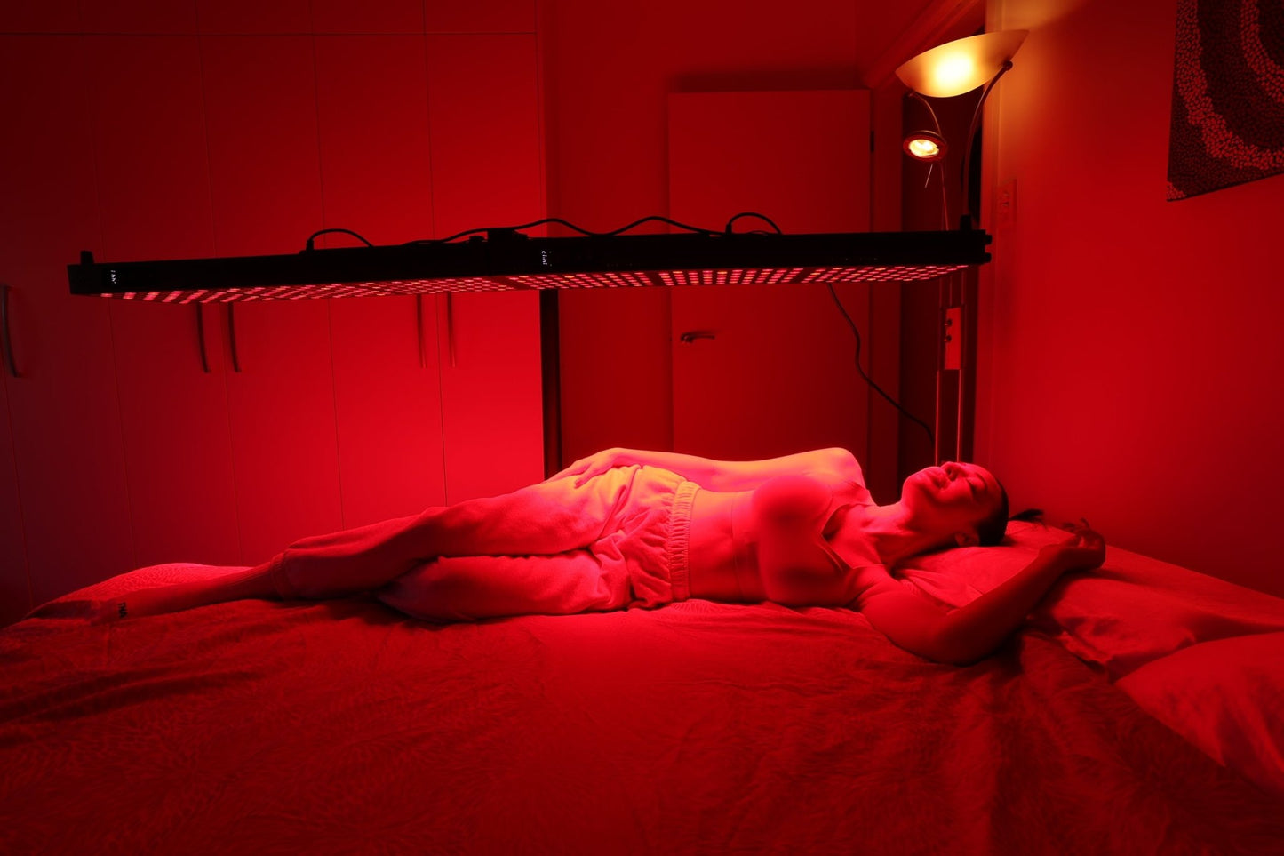 Person lying beneath a Hero300 panel mounted horizontally on an overhead stand