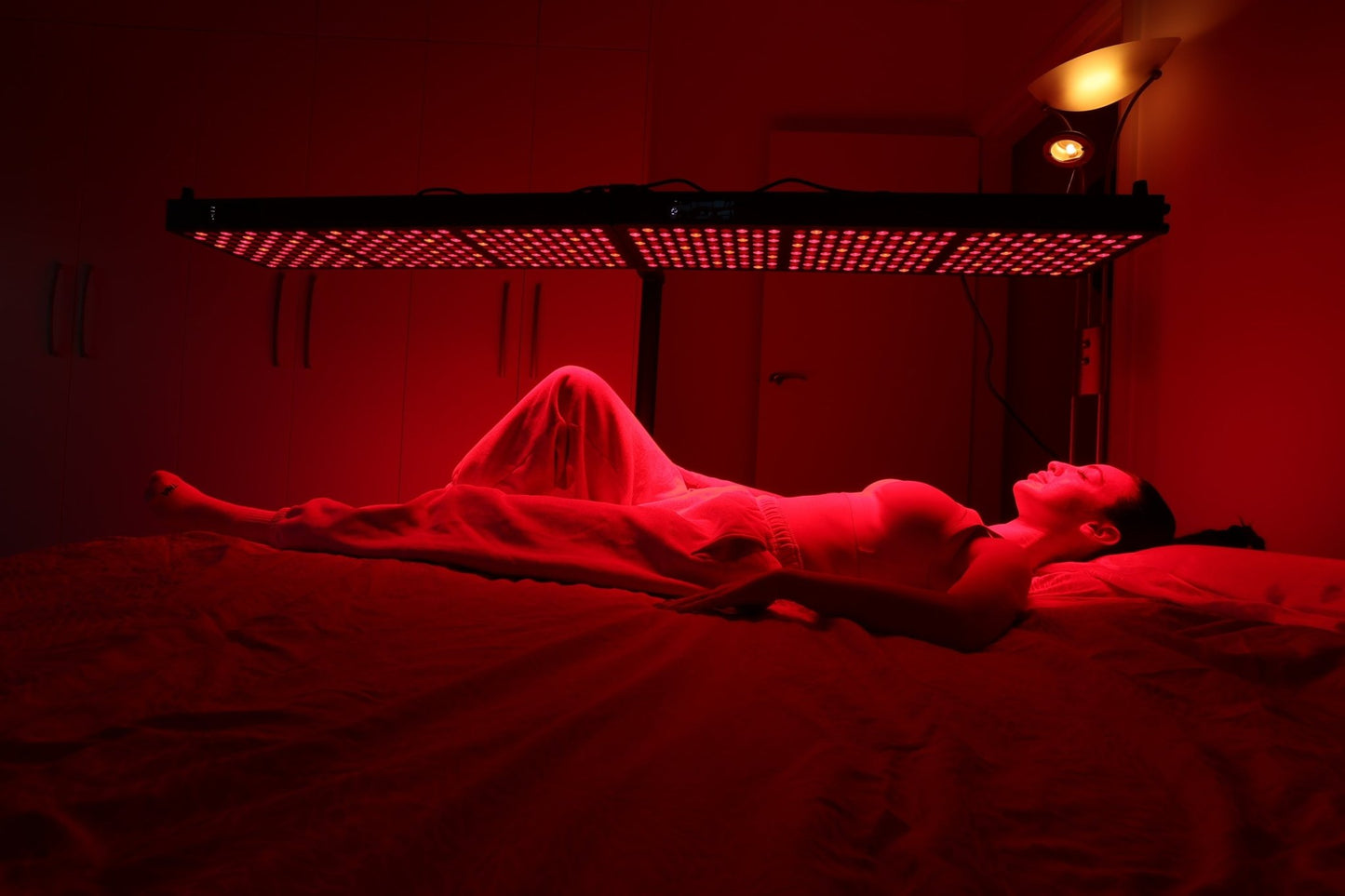 Person lying beneath a Hero300 panel mounted horizontally overhead