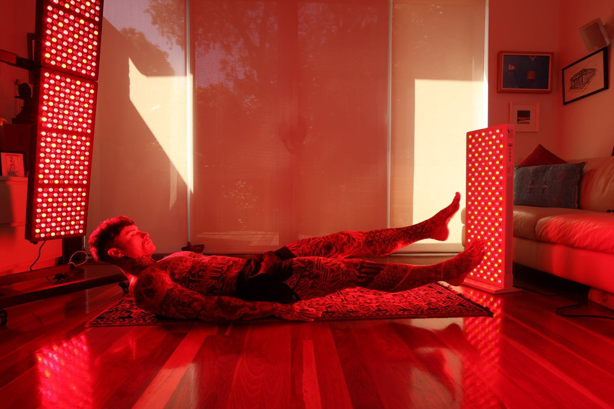 Person lying between two Hero300 panels in a living room