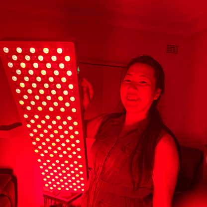 Woman holding a glowing white Hero300 panel