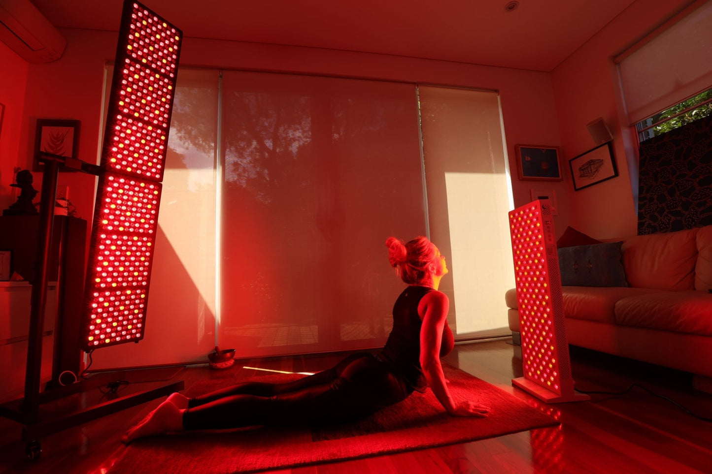 Woman in cobra pose between two Hero300 panels